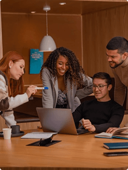 Team members talking in the office